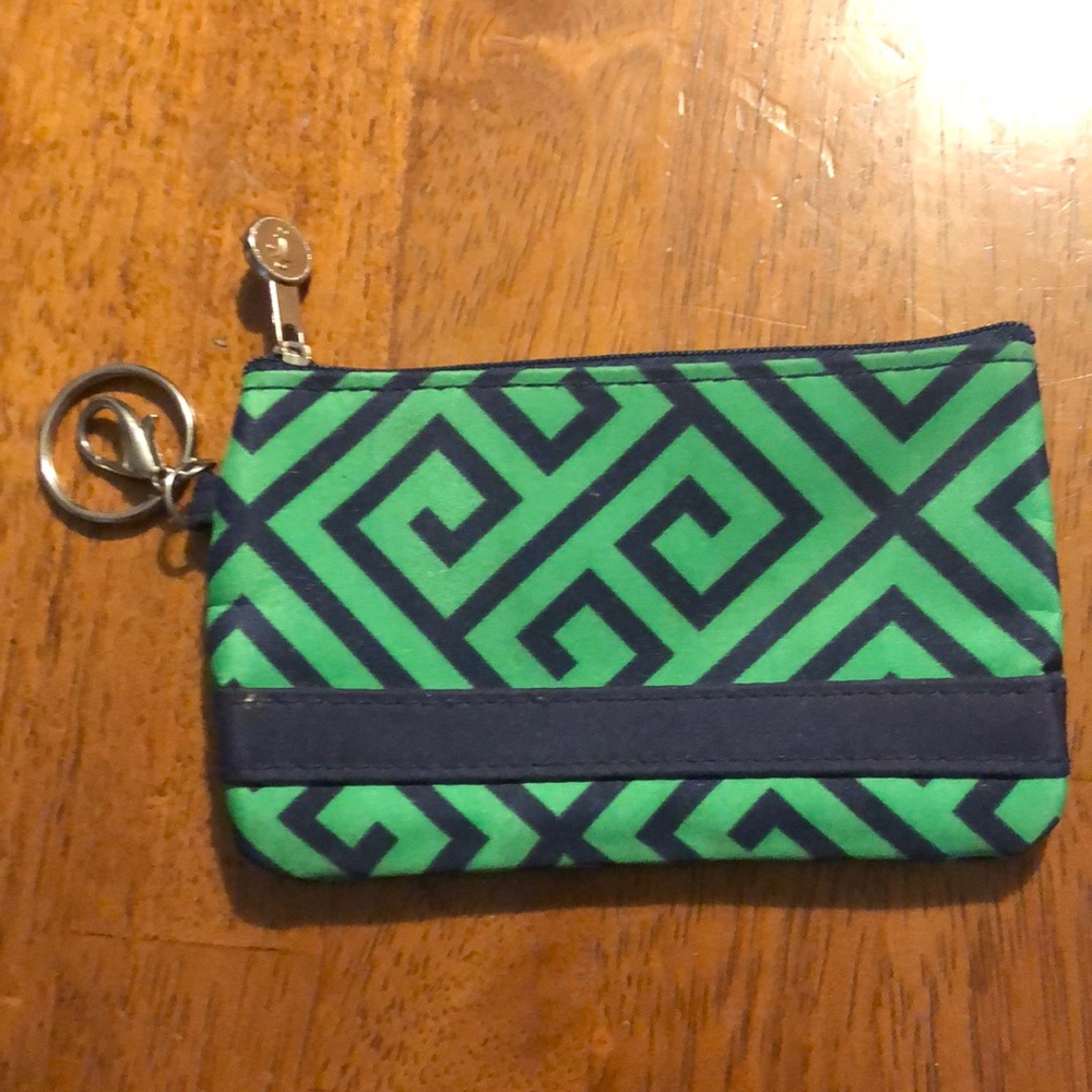 Initials, inc. ID, cash, credit cards wallet/key chain.